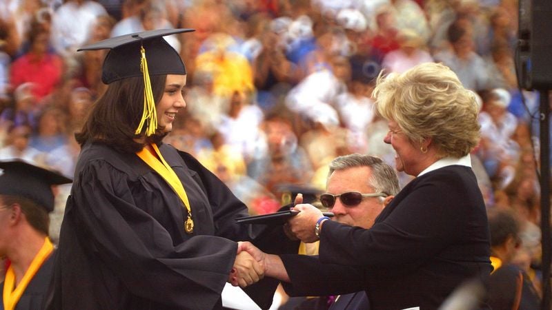 Teary-Eyed Student Loan Officers Proudly Watch As $200,000 Asset Graduates From College