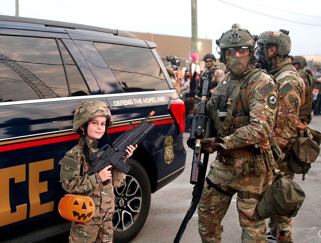 ICE Agent, 7-Year-Old Both Wearing Same ‘Military Commando’ Halloween Costume